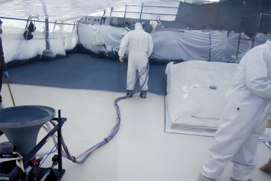 Pentech S6MM Non-Skid Spray Machine being used to coat the fore deck of a U.S. Navy Destroyer